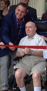 Centre Champlain resident former Verdun councillor John Gallagher cuts the ribbon next to Verdun mayor Jean-François Parenteau