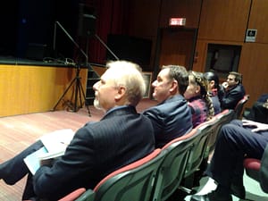 Jean-François Lisée sitting next to Jean-François Parenteau at the Verdun Aquatic Centre funding announcement